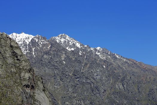 Caucasus mountains under snow and clear blue sky