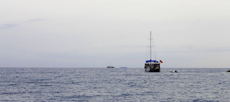 Sail ship moving away from the shore