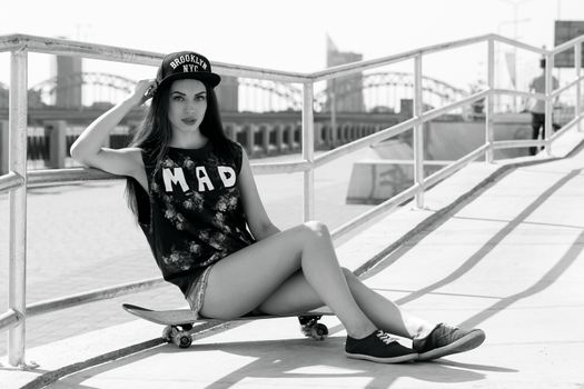 Street, outdoor. Attractive teen in a cap