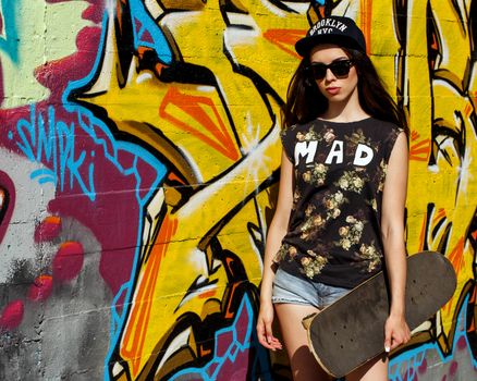 Street, outdoor. Attractive teen in a cap