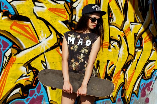 Street, outdoor. Attractive teen in a cap