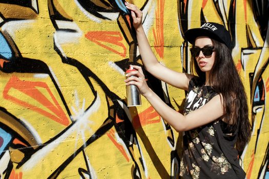 Street, outdoor. Attractive teen in a cap