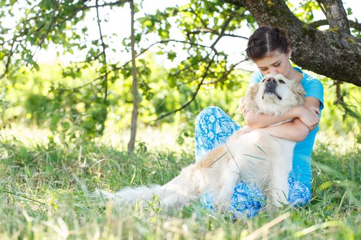 Cute girl in blue dress with adorable dog