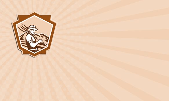 Business card showing illustration of organic farmer with pitchfork facing front set inside shield done in retro woodcut style