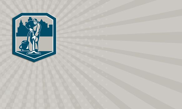 Business card showing illustration of a janitor carpet cleaner worker vacuuming with vacuum cleaner carpet cleaning machine viewed from front with buildings set inside shield done in retro style.