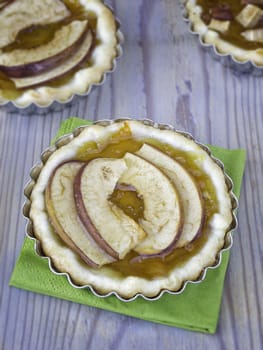 Three apple tarts on wood table