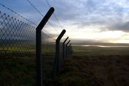 barbed wire fencing protecting a site on the Knockanore hill in Ballybunion county Kerry Ireland