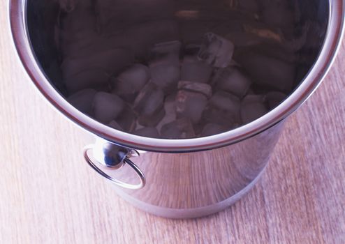 Metal bucket for wine with ice inside