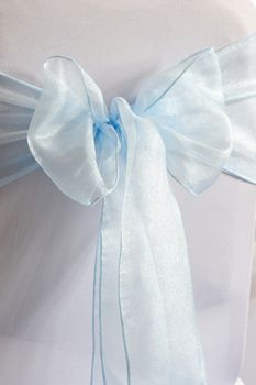 Blue and white chair cover at a wedding reception