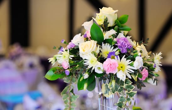 Flowers decorate table at wedding reception