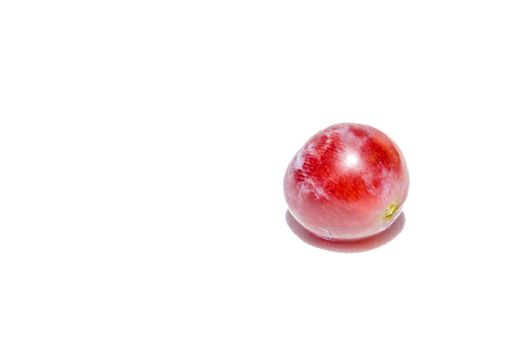 Red grape isolated on white background.