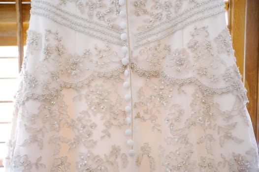 Brides dress close-up showing detail on wedding day