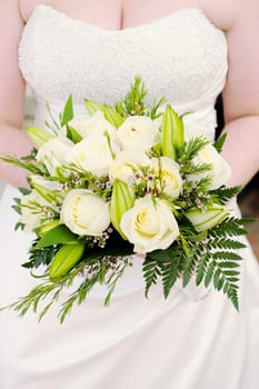 Closeup of brides white roses on wedding day