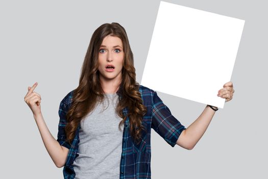 Beautiful woman with white billboard