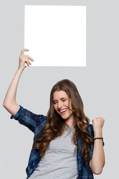 Beautiful woman with white billboard