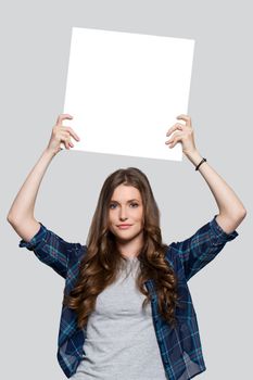 Beautiful woman with white billboard