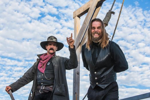 Western Man Awaits Execution of Being Hung From the Neck At Gallows