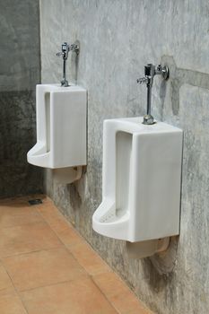 Urinals in a public restroom