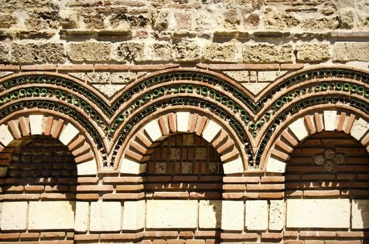 Old Stone Exterior Decoration With Arc and Different Elements