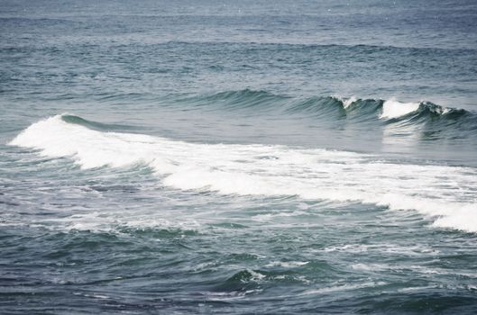 Photo of the Wavy Sea Blue Background 