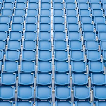 Blue seat in sport stadium, empty seats ready for the public