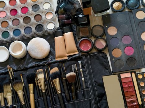 Photo of a set of makeup, applicators and brushes from a professional makeup artist.