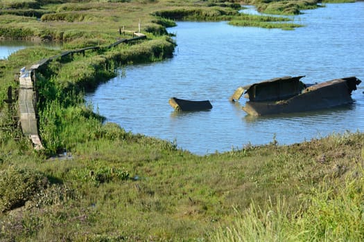 Estuary with wreck and path