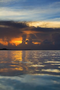 Sun peaking through dark clouds