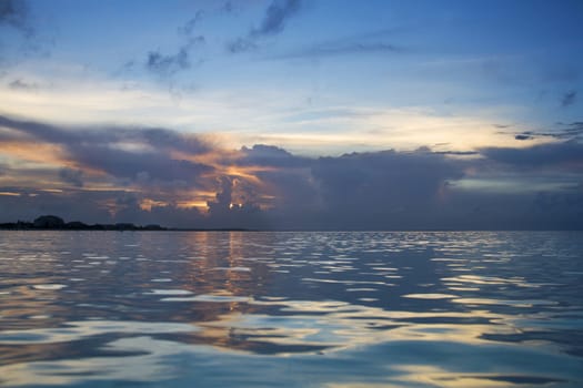 last rays of the sun peaking through dark clouds