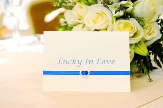 Closeup wedding reception decoration card and flowers