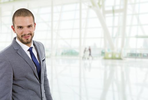 young happy businessman portrait at the office