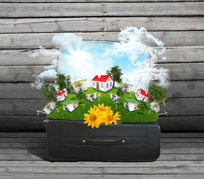 Travel bag with houses and trees on old wooden surface