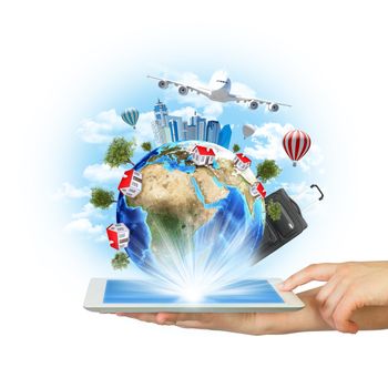 Hands hold tablet pc with Earth, buildings and trees. Elements of this image are furnished by NASA