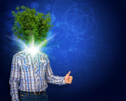 Man stand with green tree and bright light instead his head. Eco concept