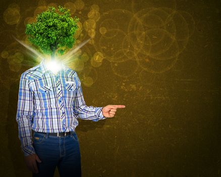 Man stand with green tree and bright light instead his head. Eco concept