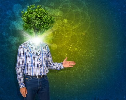 Man stand with green tree and bright light instead his head. Eco concept