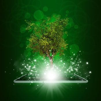 Tablet pc with magical green tree and rays of light on dark background
