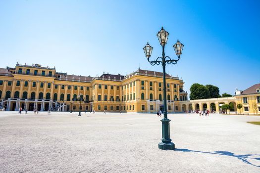 VIENNA, AUSTRIA - AUGUST 4, 2013: Schonbrunn Palace royal residence courtyard on August 4, 2013 in Vienna, Austria.