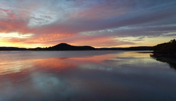 Beautiful sunrise from  Koolewong and reflections on the Brisbane Waters with picturesque views to Woy Woy Channel, Pelican Island and Saratoga, magnificent, sky, clouds, 