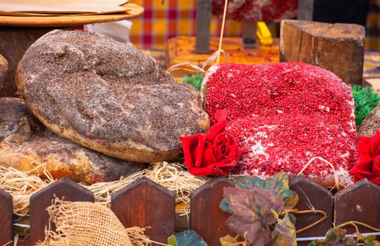 Close up of Italian raw ham covered by pepper