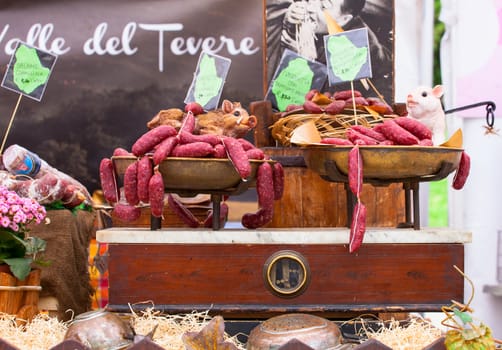 Close up of delicious Italian salami on the vintage scale