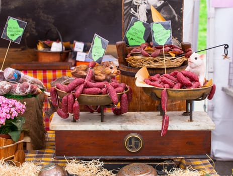 Close up of delicious Italian salami on the vintage scale