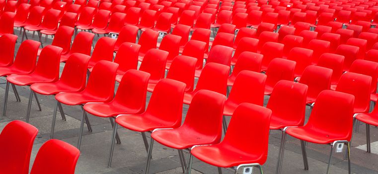 View of many red chairs ready for conference