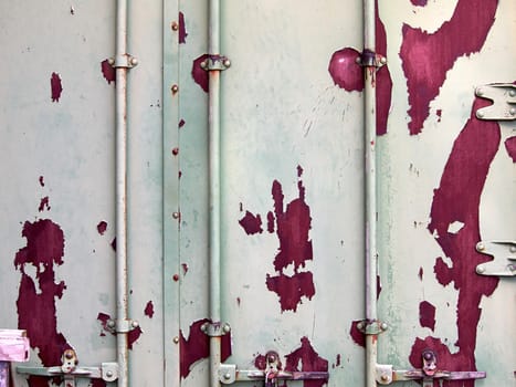 Closeup of cargo freight shipping containers with rust spots
