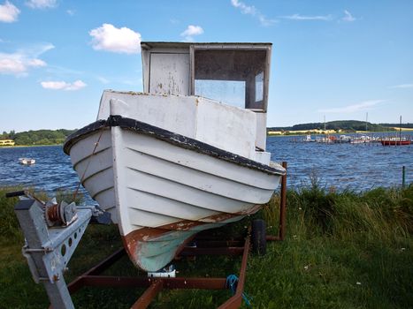 Small wooden old fishing boat on the beach Funen Denmark   