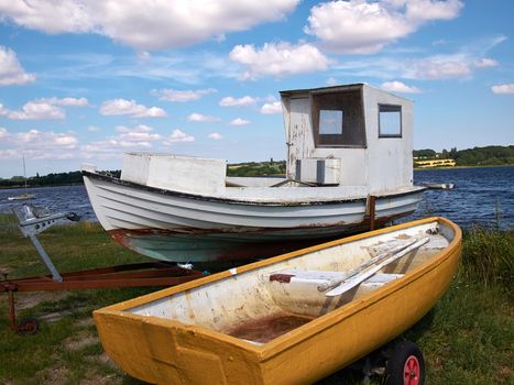 Small wooden old fishing boat on the beach Funen Denmark