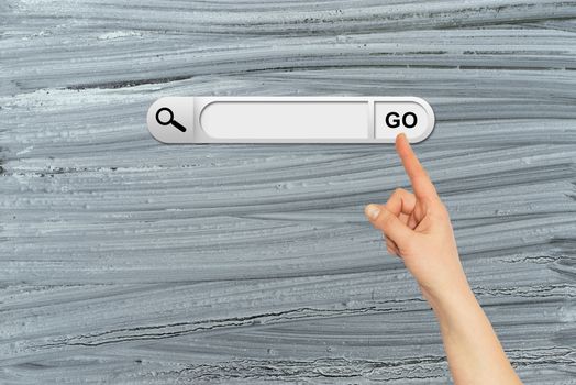 Human hand indicates the search bar in browser. Old and rough painted surface on background
