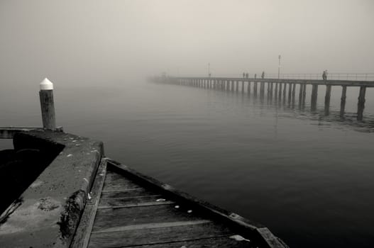 Black and white image of Winter mist over the sea