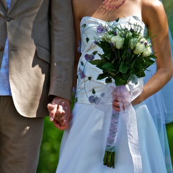 Wedding Couple Standing With Bouquet