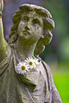 Graveyard figure with flowers